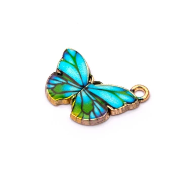 Kék pillangó képes medál, 15x20 mm (1 db)