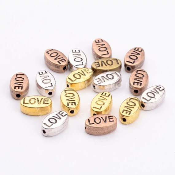 Ovál love (vegyes szín) köztes dísz, 10x6 mm (10 db)